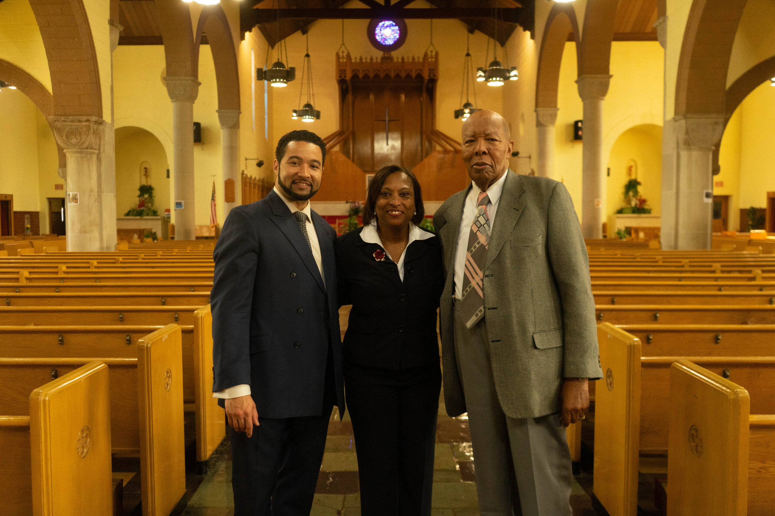 James Cole Foundation Commonwealth Event, three people smiling inside a church