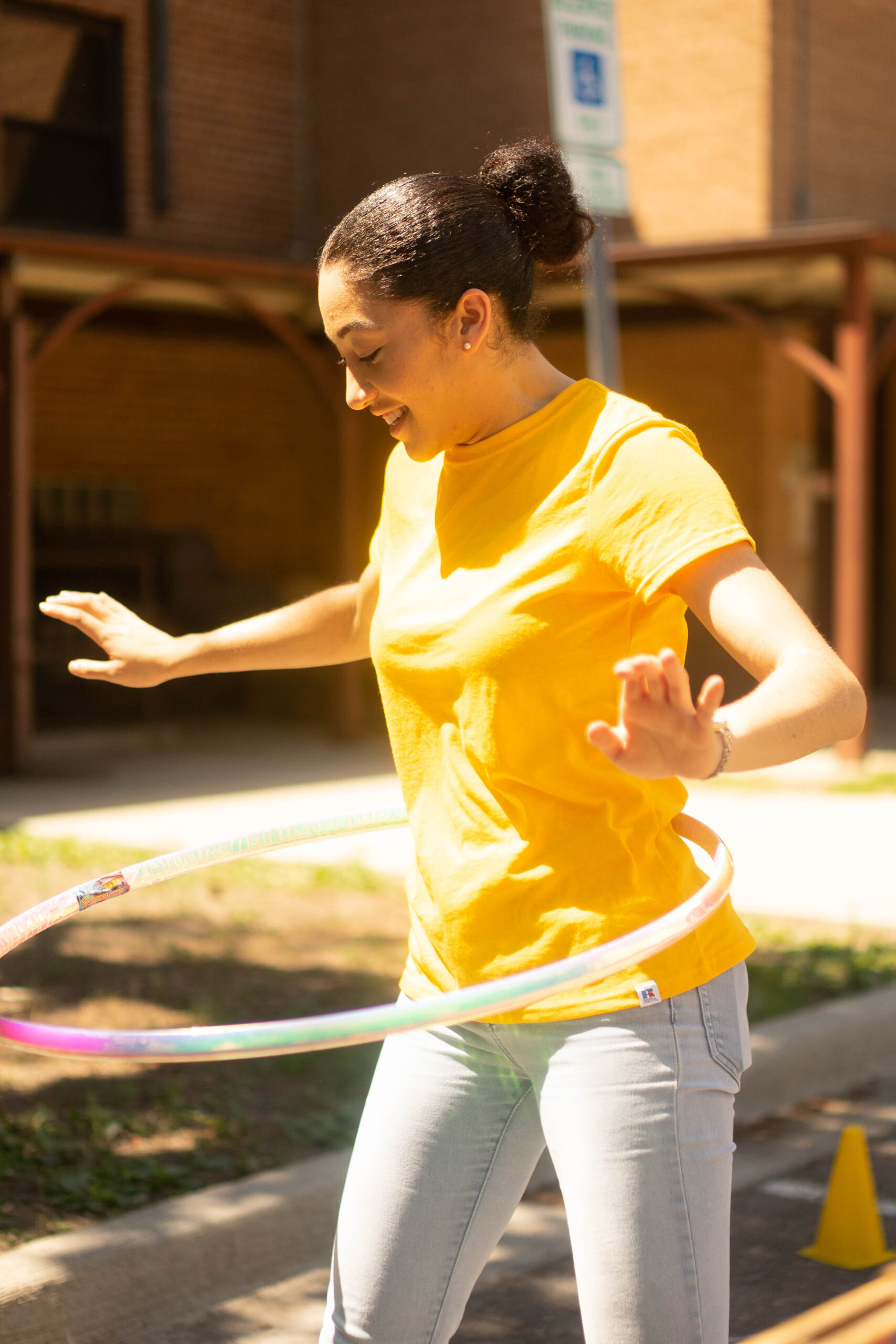 James Cole Foundation Event COTS, girl with a hula-hoop outside