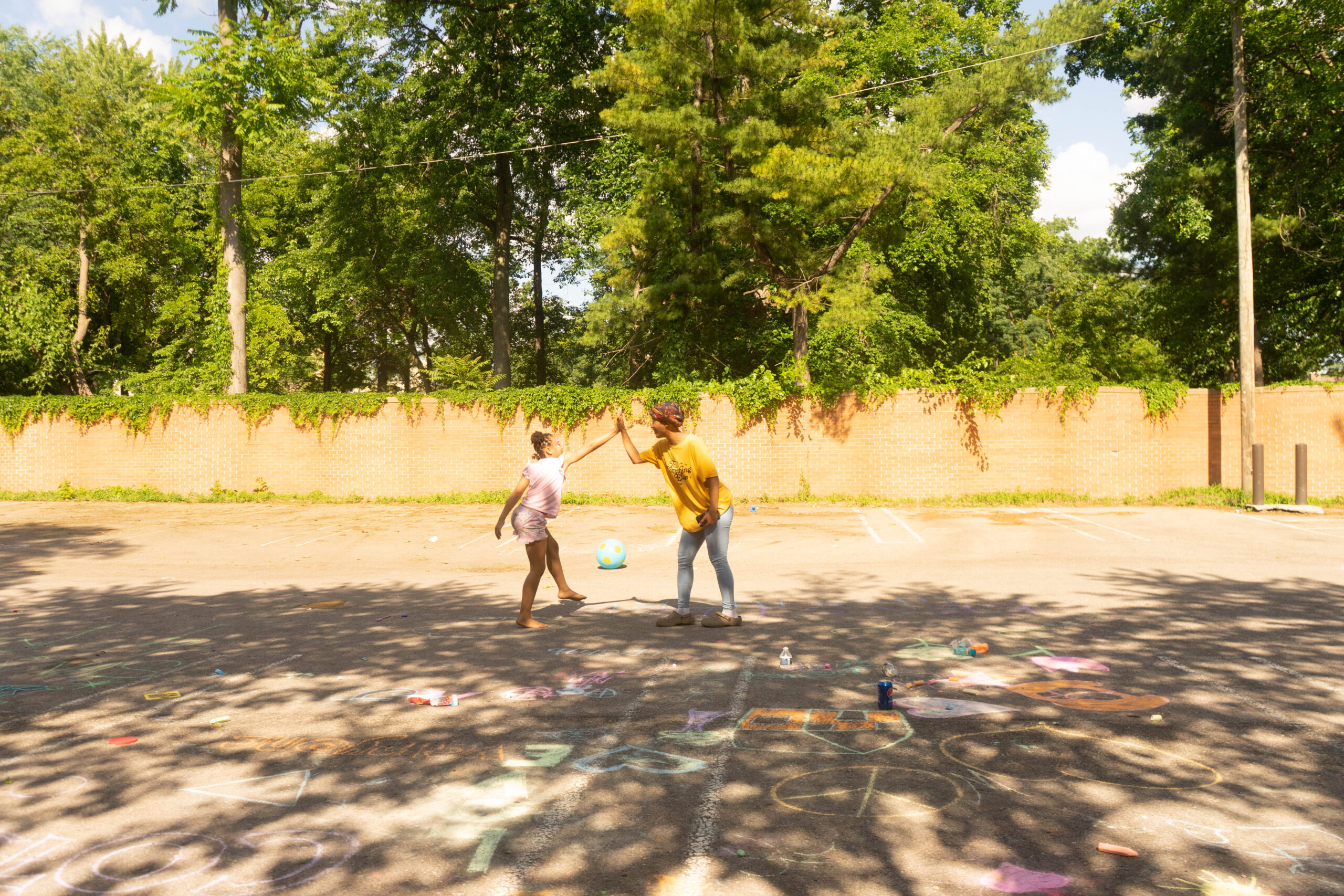 James Cole Foundation Event COTS, mother and daughter playing outside