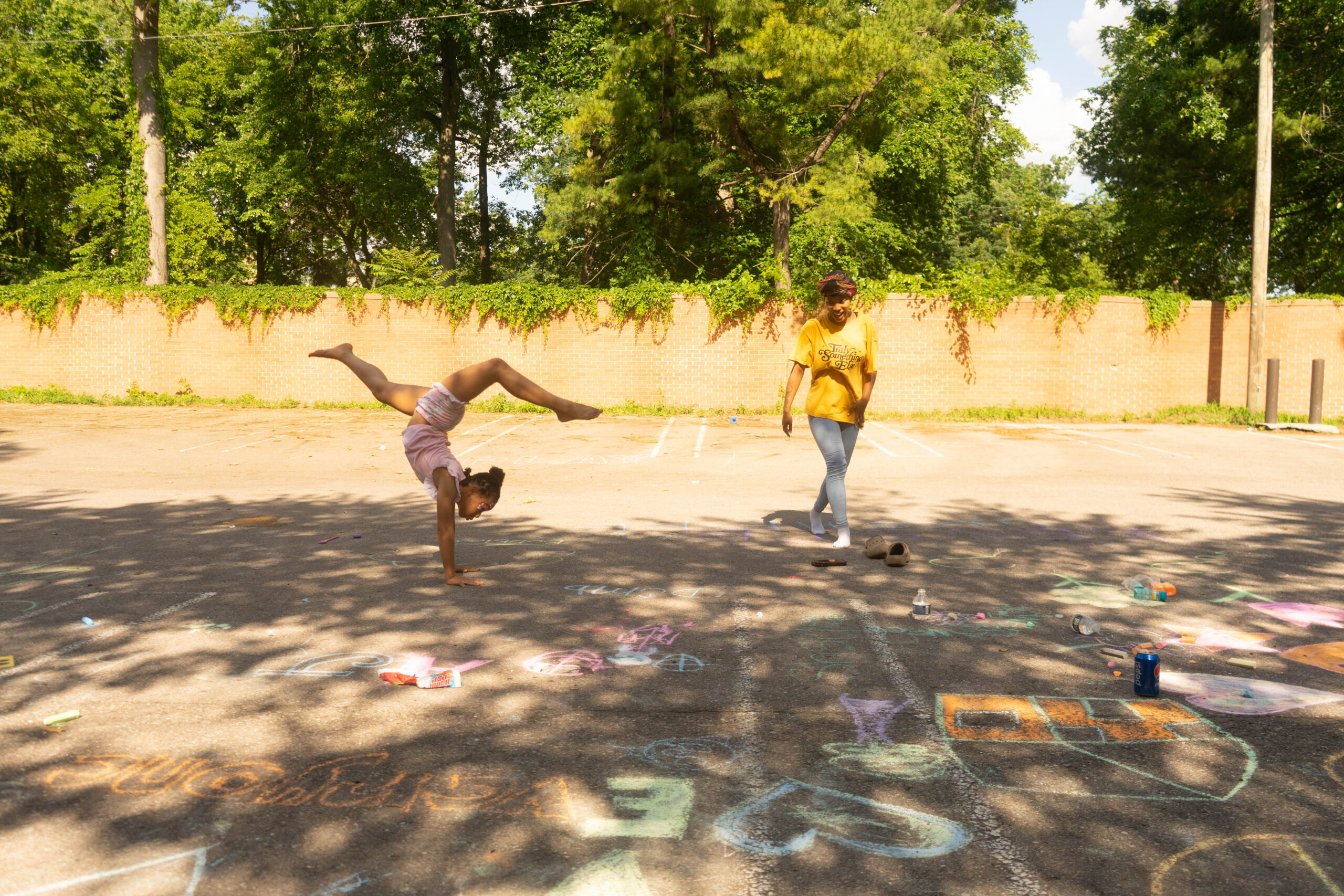 James Cole Foundation Event COTS, girl doing handstand outside