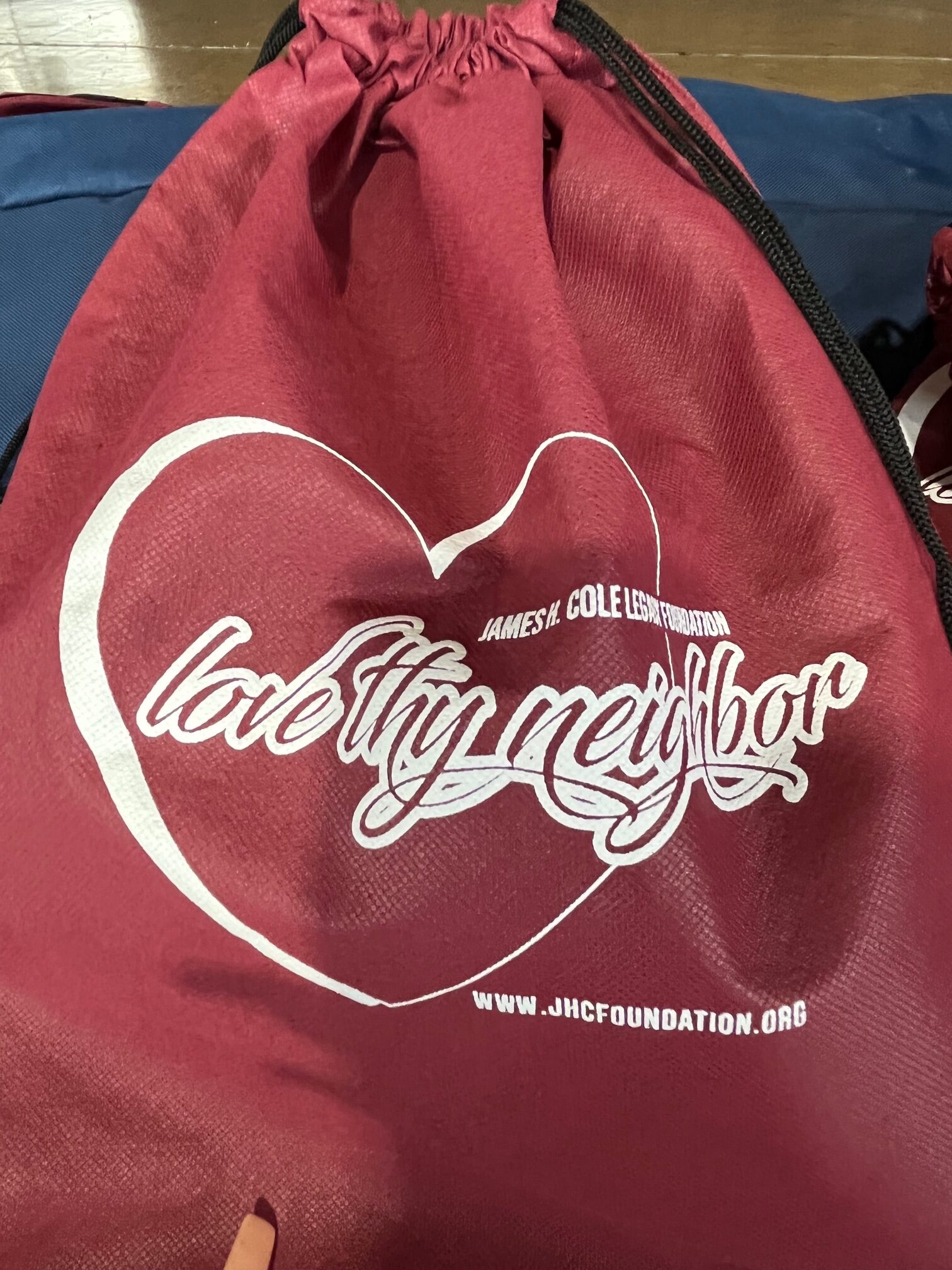 James Cole Foundation, Love Thy Neighbor backpack at Commonwealth event
